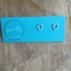 Pair of small triangle stud earrings pointing 'down' on turquoise Porth earring card.