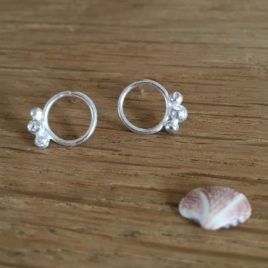Circle and silver pebble studs.