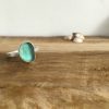 Aqua Seaglass ring on a round hammered ring made by Tania in Seaglass Sessions.