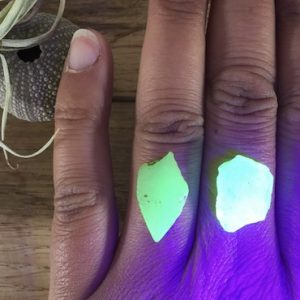 UV seaglass suitable for bespoke ring orders, shown on fingers.