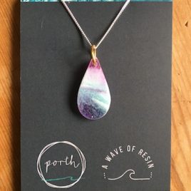 Resin Necklace displayed on a grey card